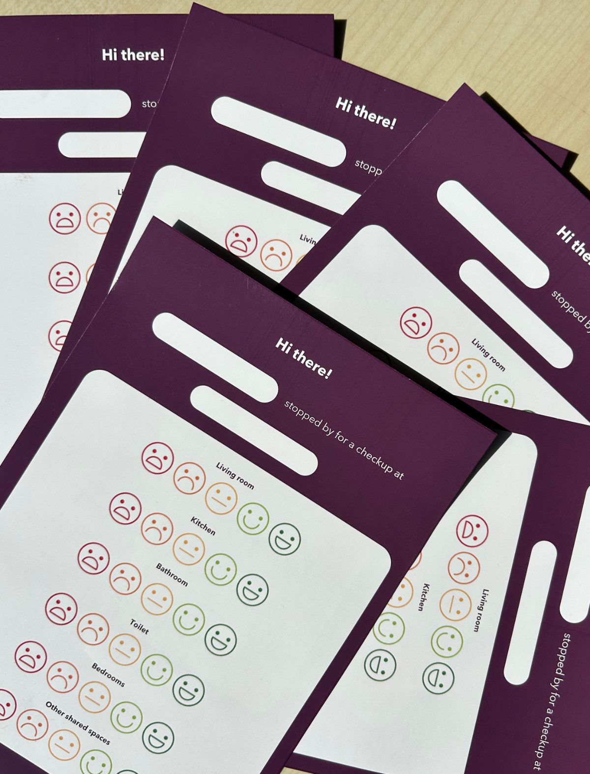 printed purple check-up cards, one per room